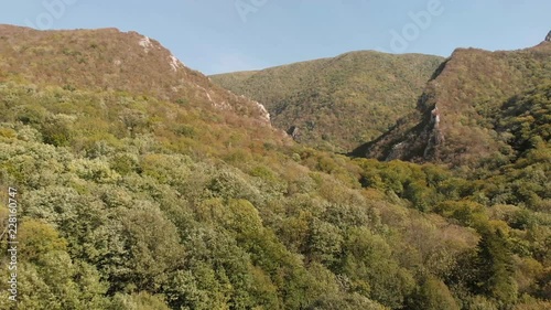 Aerial view of mountains in national park Cheile Nerei Beusnita in Romania. Part of Carpathian mountains with beautiful autumn colors.