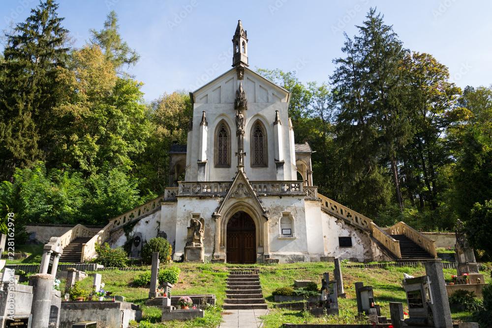 Saint Maximilian Chapel on cemetery in Saint John under the Cliff, Svaty Jan pod Skalou, Czech Republic, sunny summer day