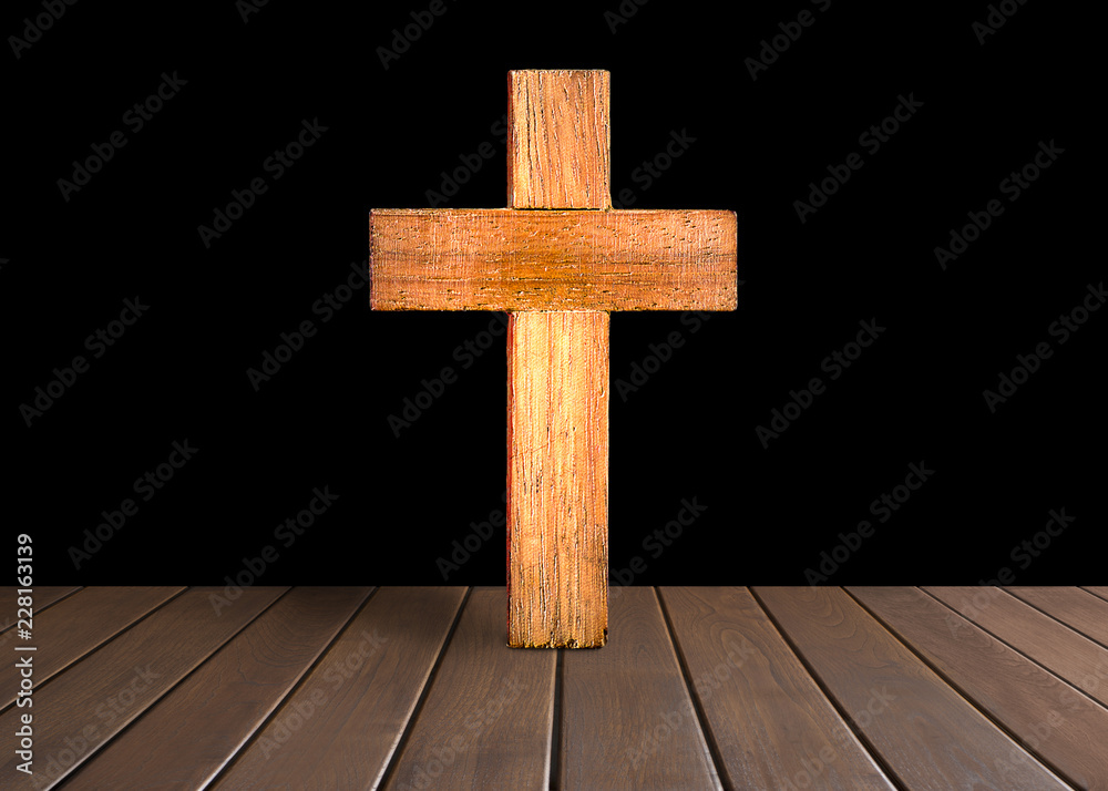 Antique wooden cross with black background