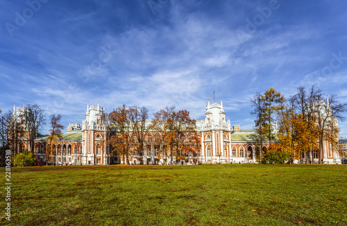 People walk near the Grand Tsaritsyn Palace on a sunny autumn day, Moscow, Russia