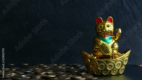 Maneki Neko Japanese lucky cat waving paw and many different coins