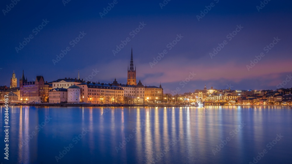 Scenic view of the old town by night with Riddarholmen, Gamla Stan and Sodermalm islands, Stockholm, Sweden