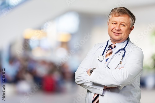 Handsome doctor portrait on background