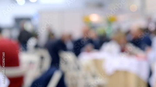 Wallpaper Mural People sit in a restaurant Blurred Background. White and gray black colors Torontodigital.ca