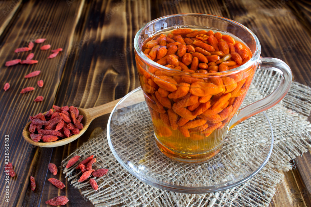 Drink with goji berries on the rustic wooden background Drink with goji berries on the rustic wooden background