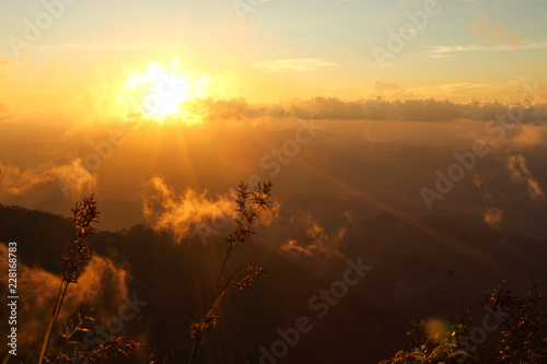 Golden sunset at the peak of Phu Miang, Udtaradit province, Thailand photo