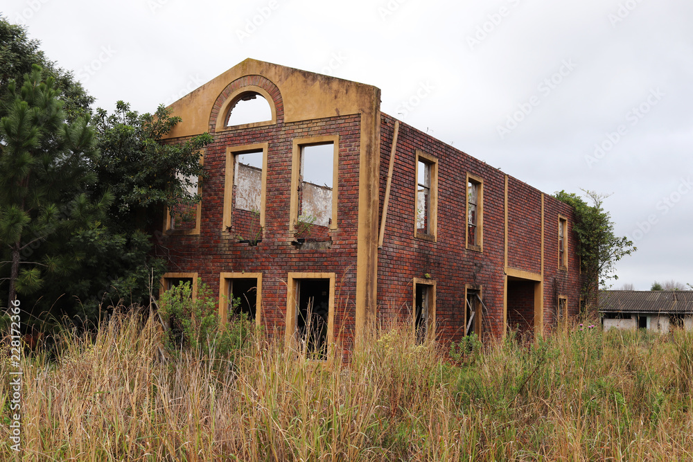 Nature taking over some abandoned buildings in South Africa. Post apocalyptic/nuclear fallout concept image. Nature taking over some abandoned buildings in South Africa. Post apocalyptic/nuclear fallout concept image.