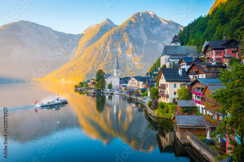 Hallstatt with ship at sunrise, Salzkammergut, Austria photo