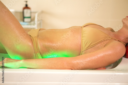 Beautiful woman having exfoliation treatment in spa