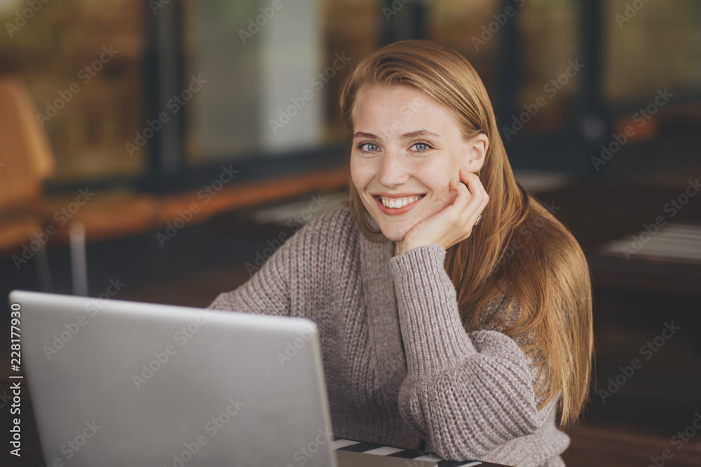 woman working with laptop in cafe