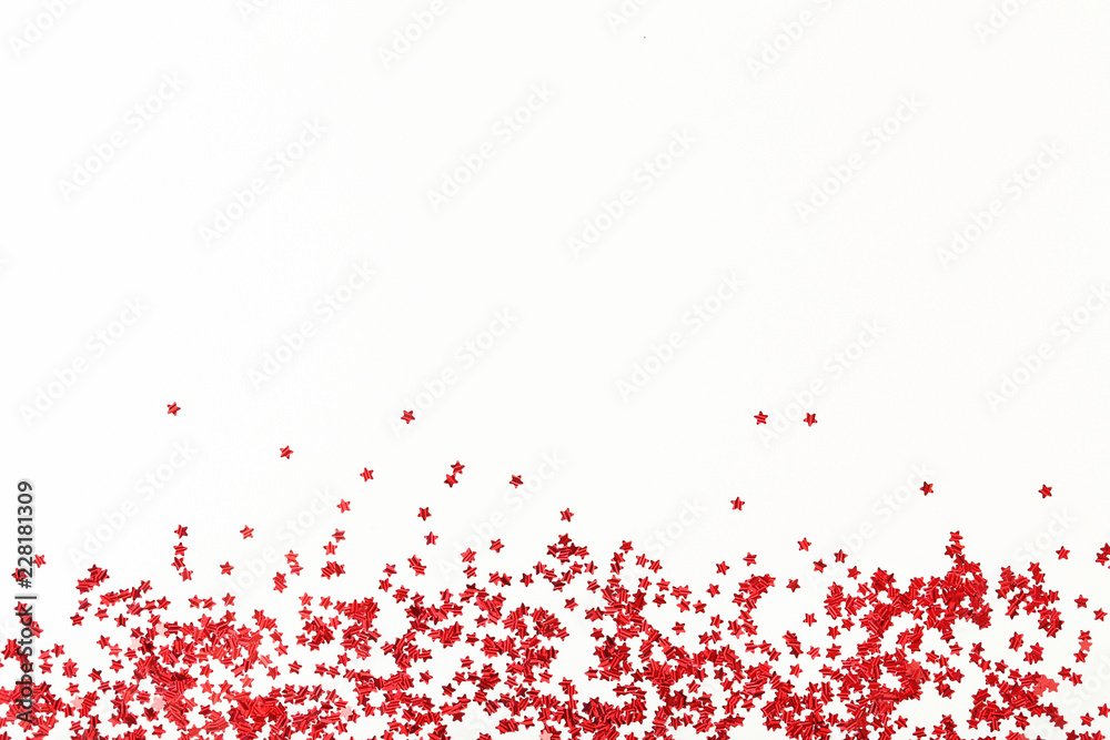 Red confetti on white background