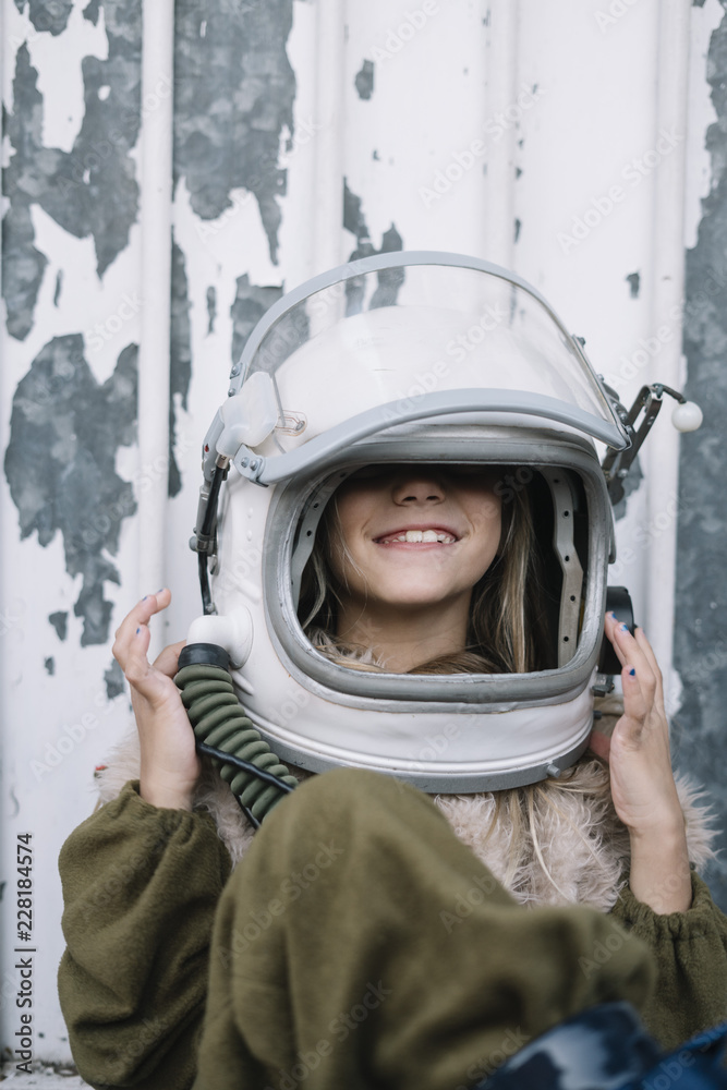 Little Girl with blue eyes and astronaut helmet Little Girl with blue eyes and astronaut helmet