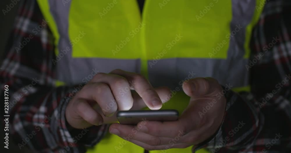A contractor checking online gambling account and winning at work A contractor checking online gambling account and winning at work