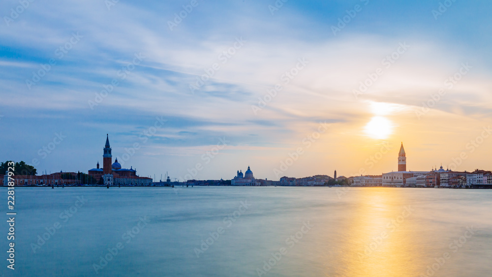 San Giorgio Maggiore, Santa Maria della Salute, and St. Mark's Bell Tower at sunset, in Venice, Italy