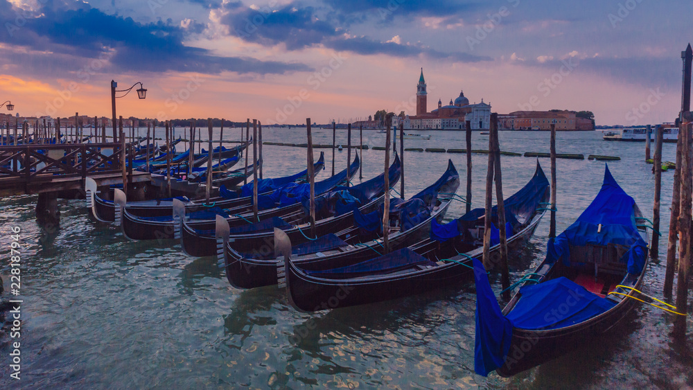 Gondolas at sunrise in Venice, Italy