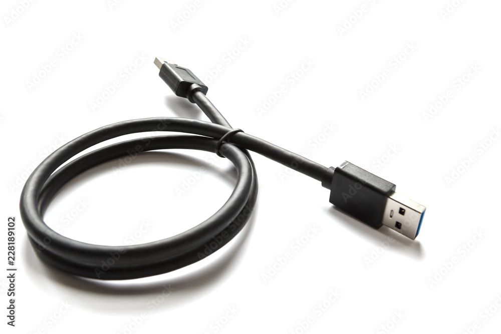 Black USB cable on white background. Connector close-up. Black USB cable on white background. Connector close-up.