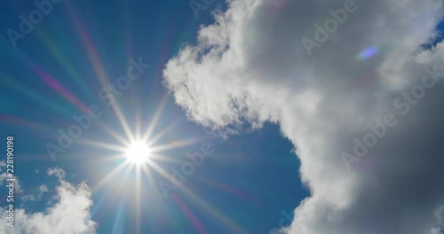 4K - Beautiful summer sun with clouds photo