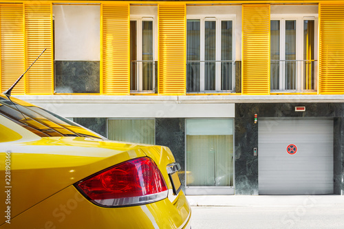 Yellow car parked on the street