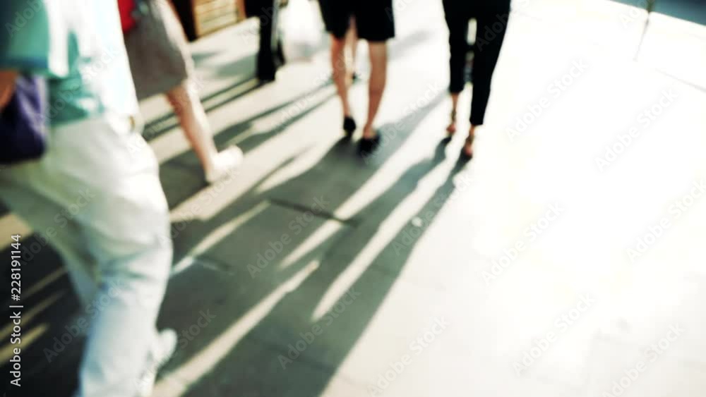 Slow motion pedestrians walking on street - above view Slow motion pedestrians walking on street - above view