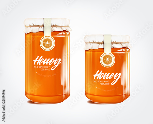 Honey in glass jar isolated with label.