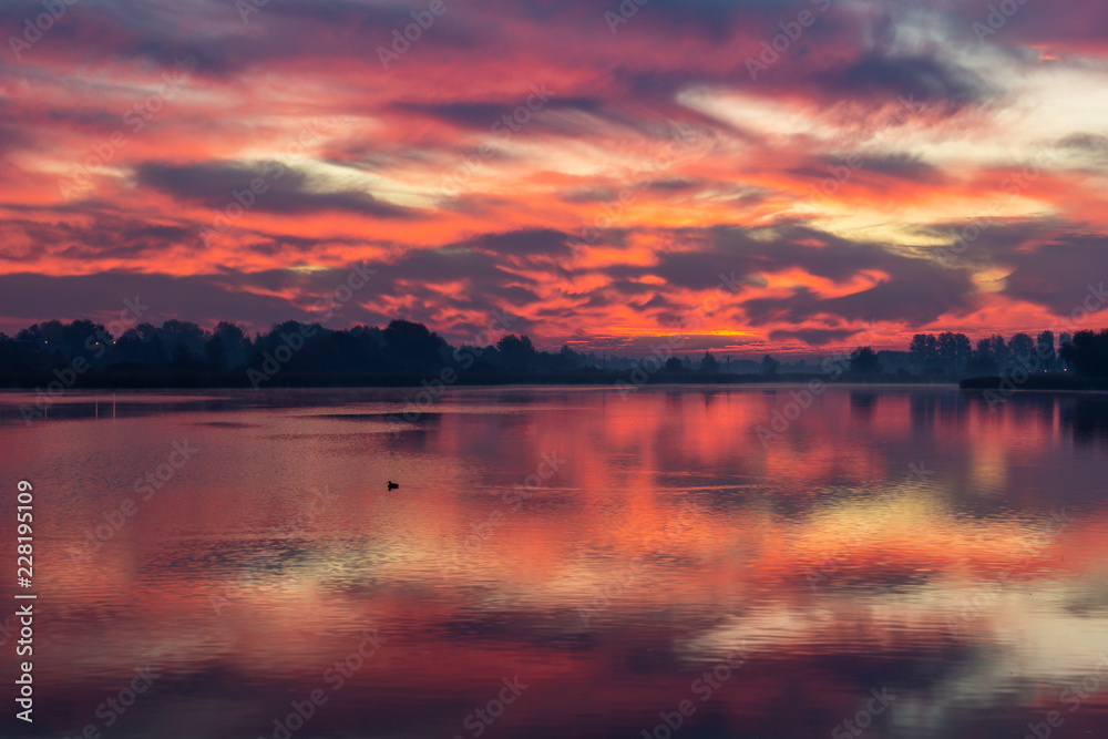 Dawn over the pond at autumn in Falenty near Raszyn, Masovia, Poland