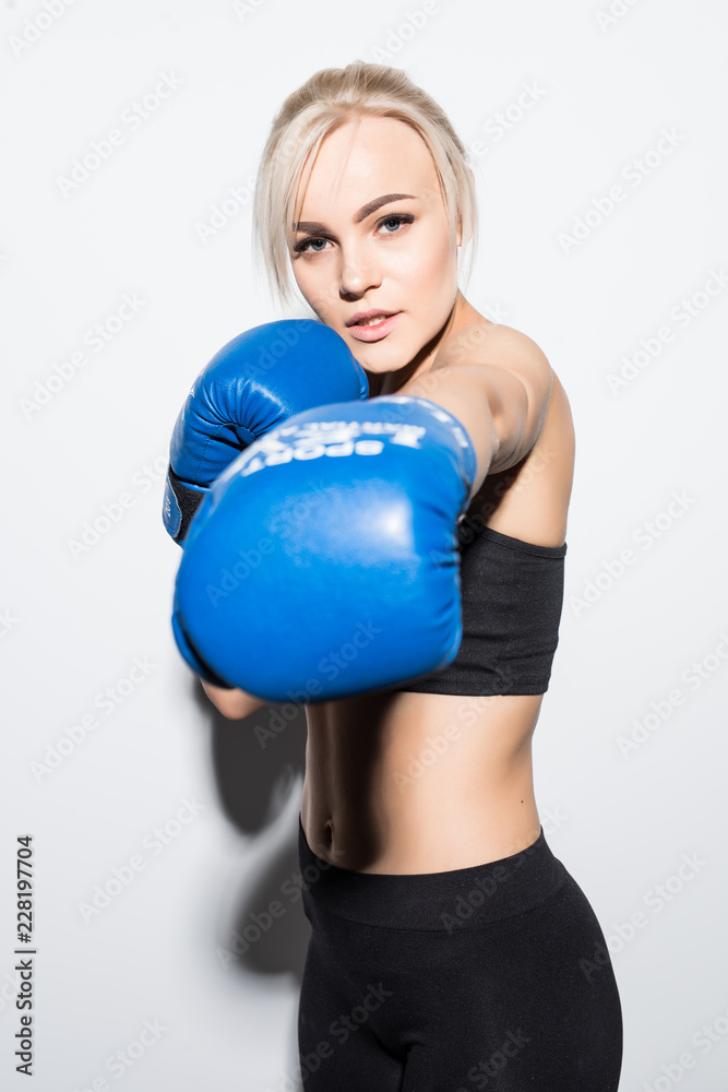 Young boxing Woman on white background. Boxer woman during boxing exercise. Girl training body combat. Woman boxer boxing isolated on white background Young boxing Woman on white background. Boxer woman during boxing exercise. Girl training body combat. Woman boxer boxing isolated on white background
