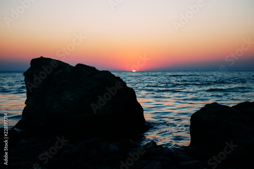 Sunrise on the summer sea in blue hour photo