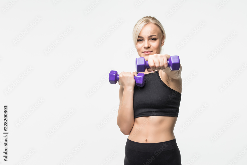 portrait of pretty sporty woman holding weights isolated on gray background portrait of pretty sporty woman holding weights isolated on gray background