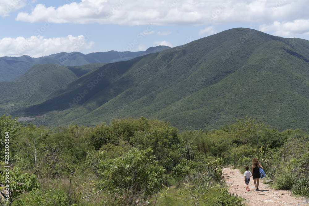 Mother and son walking in mountains Mother and son walking in mountains