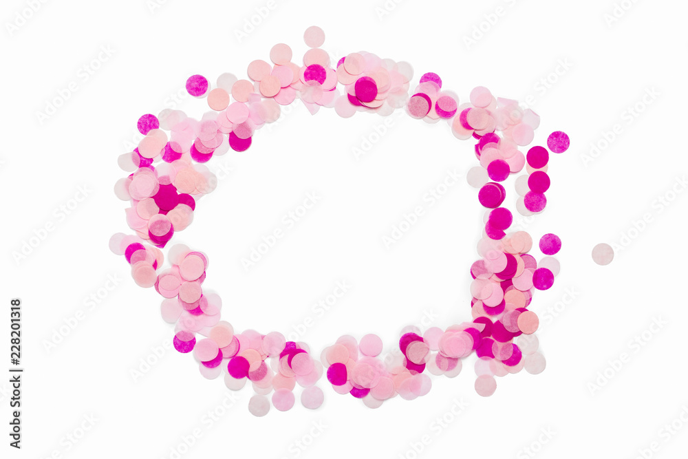 Pink confetti on a white isolated background. Circle shape. Flat lay, top view