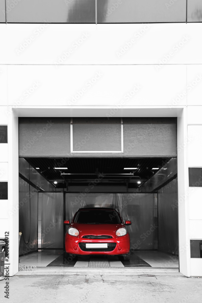 Red auto at car wash. Cleaning service Red auto at car wash. Cleaning service