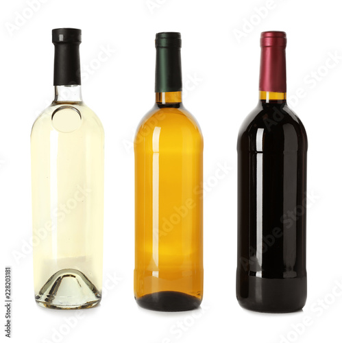 Bottle with different types of wine on white background