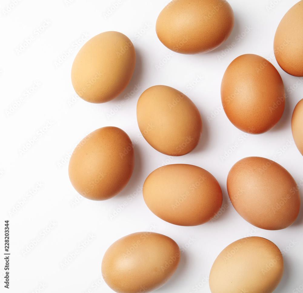 Raw chicken eggs on white background, top view Raw chicken eggs on white background, top view