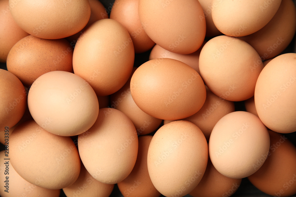 Pile of raw brown chicken eggs, top view - obrazy, fototapety, plakaty 