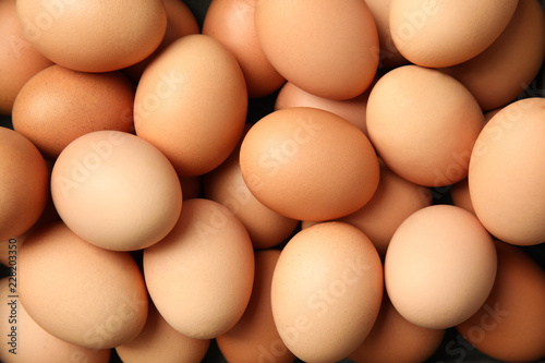 Pile of raw brown chicken eggs, top view