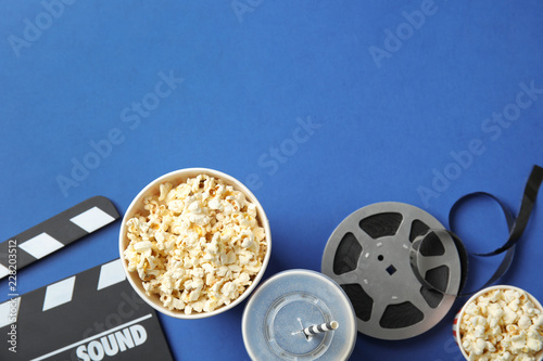 Flat lay composition with popcorn and space for text on color background. Cinema snack