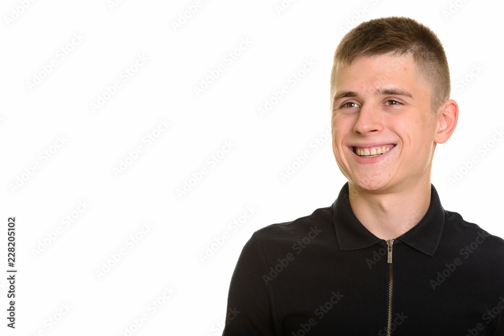 Young happy Caucasian man smiling and thinking Young happy Caucasian man smiling and thinking
