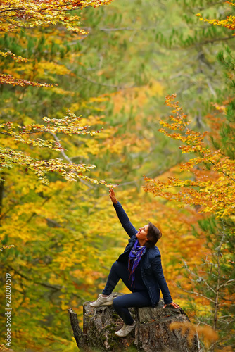 woman on a background of autumn forest