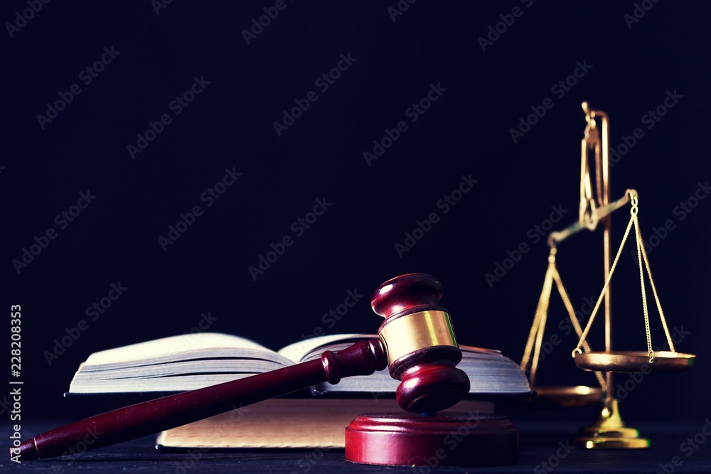 Wooden judge gavel on blurred background close-up view Wooden judge gavel on blurred background close-up view