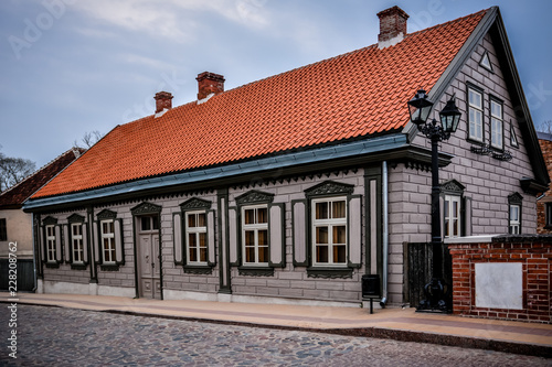Old historic building that is renovated at old town Kuldiga, Latvia. Nice blue skies, no people. Shot in April 2015.