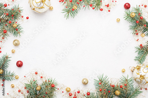 Bright Christmas frame, red and gold christmas decorations on white background. Copy space. Winter holidays, New Year.