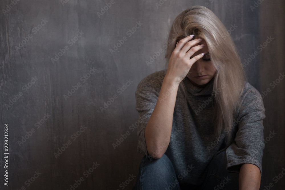 Mental health. Young woman lying on the floor Mental health. Young woman lying on the floor
