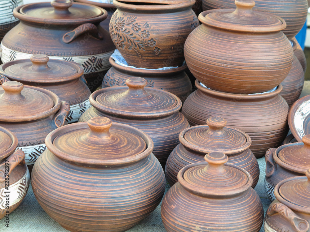 Handmade ceramic clay brown pottery, souvenirs at handicraft market Handmade ceramic clay brown pottery, souvenirs at handicraft market