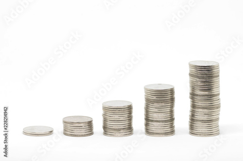 Growing coins stacks on white background. Financial growth, saving money, business finance wealth and success concept.
