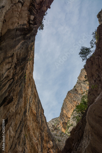Beautiful huge canyon viewed from below. Gola Su Gorropu gorge. Shot in Gola Su Gorropu canyon, Sardinia, Italy - important natural site in Sardinia.