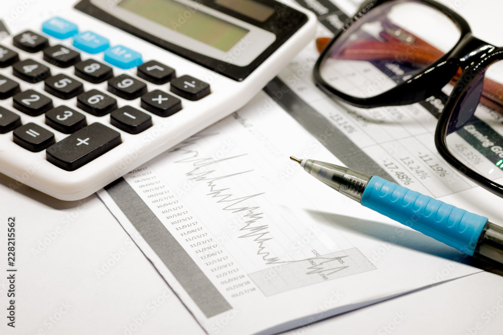 Documents, calculator and pen, glasses close-up. Business background. Documents, calculator and pen, glasses close-up. Business background.
