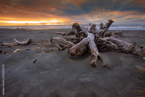 dramatic sunset  sky  hokitika beach southland new zealand photo