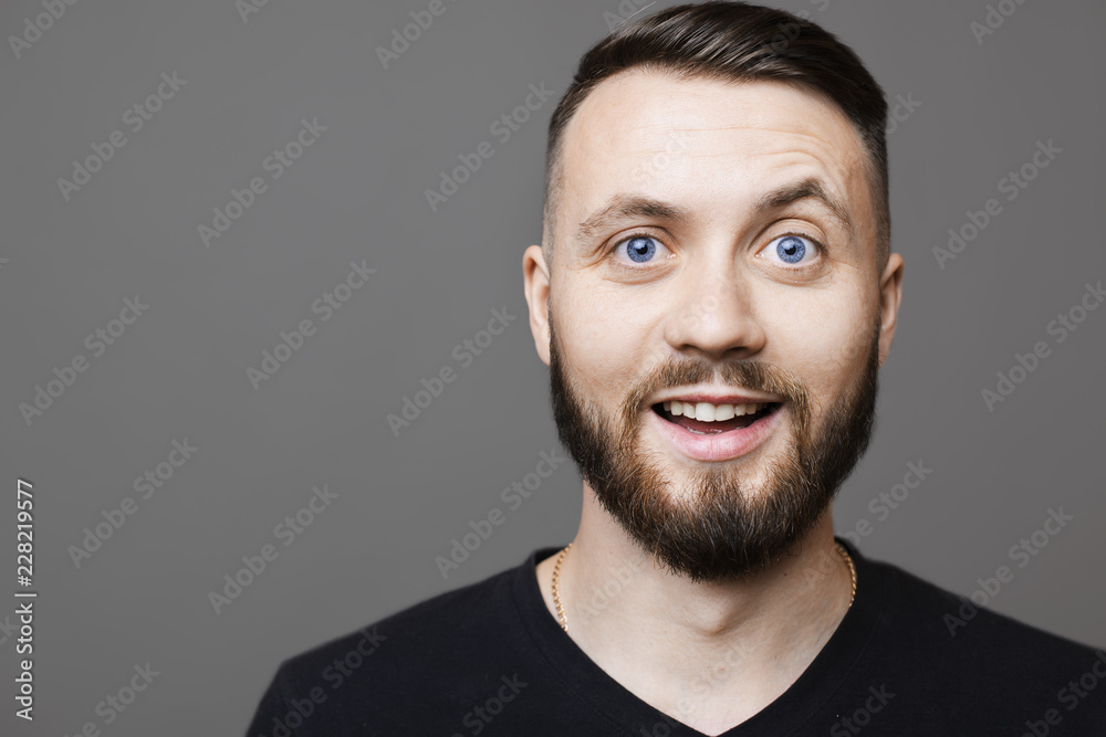 Fototapeta premium Cheerful bearded man looking at camera