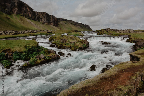 Fossalar river (waterfall) near Vatnajokull national park on Ring road in summer, Iceland, vintage look with grain