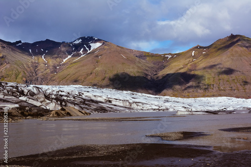 View to Skaftafellsjokull glacier with shadows of huge clouds, in Skaftafell, Iceland  on Ring road, vintage or retro effect with grain photo